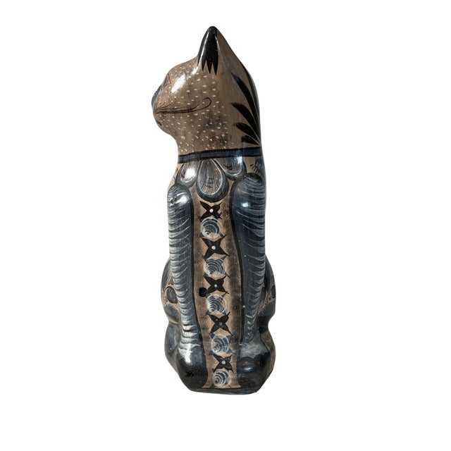 A beautiful pair of large Tonala cats with striking fantasia style painting. Inquisitive eyes and sweet smiles are the...