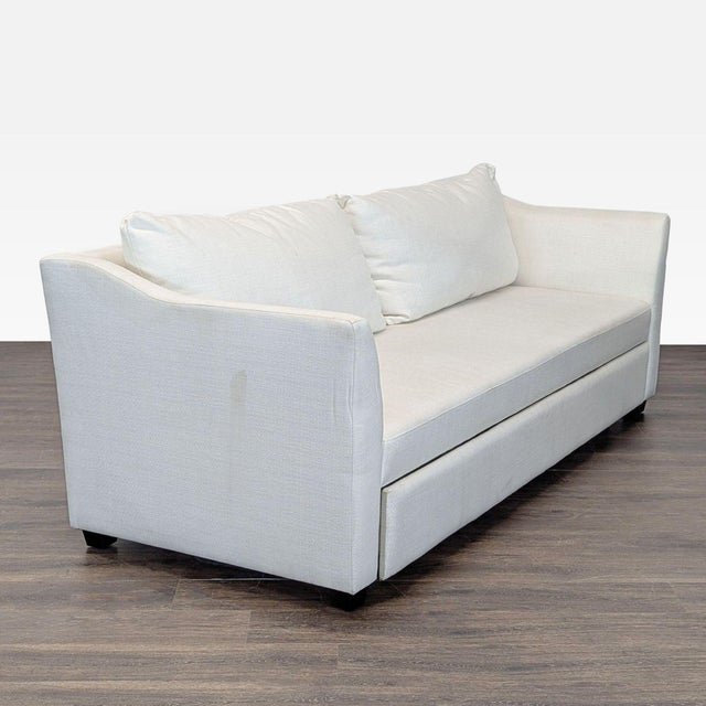 This modern cream sleeper sofa is perfect for any living space. It features a clean, simple design with comfortable...