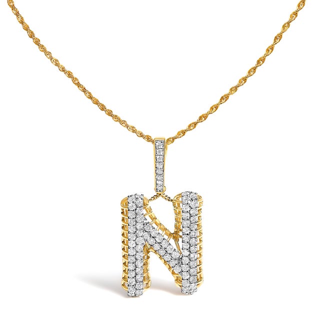 Claim your narrative in luminous strokes: a bold, rounded block initial sculpted in solid 10K yellow gold, polished to a...