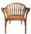Beautiful vintage handcrafted rattan chair featuring a sculptural barrel back and tightly woven seat. The quality of...