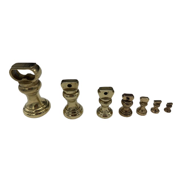 Set of Seven Solid Brass Scale Weights For Sale