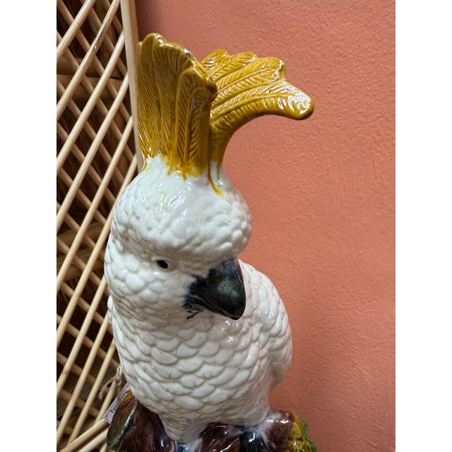 This vintage cockatoo majolica statue is very similar to the Minton cockatoo from 1870. He make a true tropical statement...