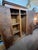 This clean armoire has nice clean lines and feature 2 doors that open to hanging space and case good folded storage space....