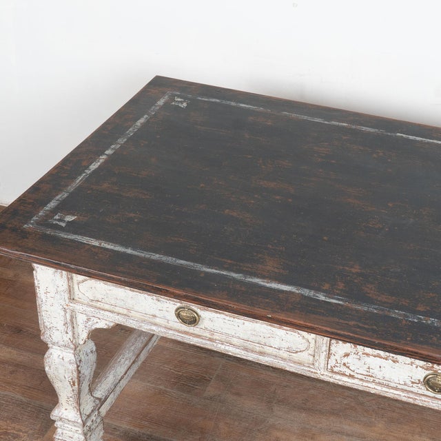 This handsome baroque oak library table with one central drawer has handsome legs and an attractive back stretcher...