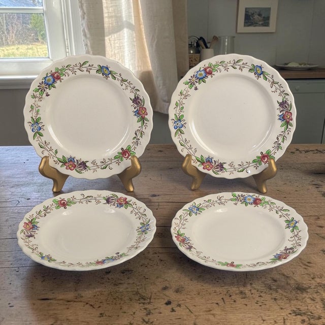 The product is a set of four vintage Spode Copeland England Felicity floral pattern dessert plates. Made of stoneware,...
