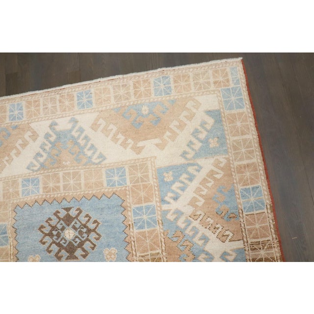 A late 20th Century Turkish Konya Rug in sky blue, browns, tans and creams