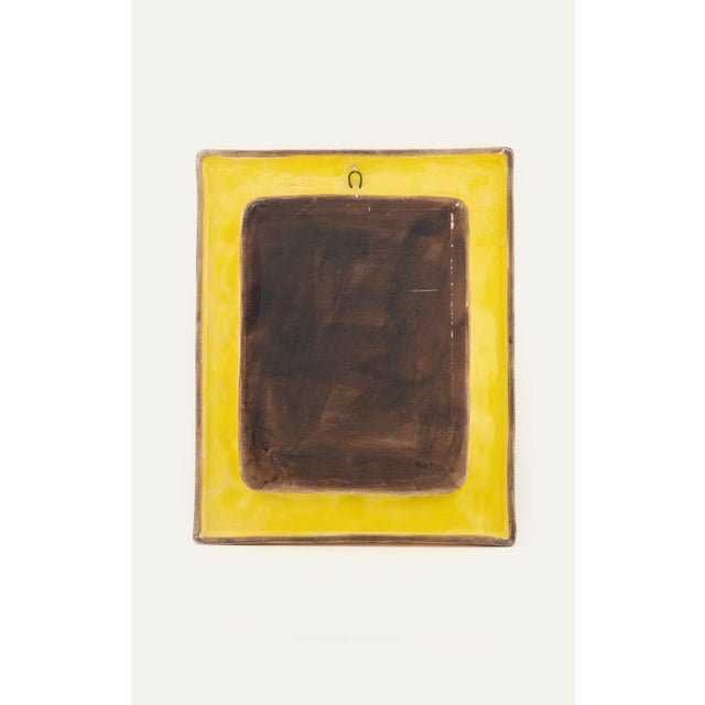 Glazed ceramic wall mirror by the French ceramicist Francois Lembo, Vallauris, circa 1970s. The rectangular frame is...
