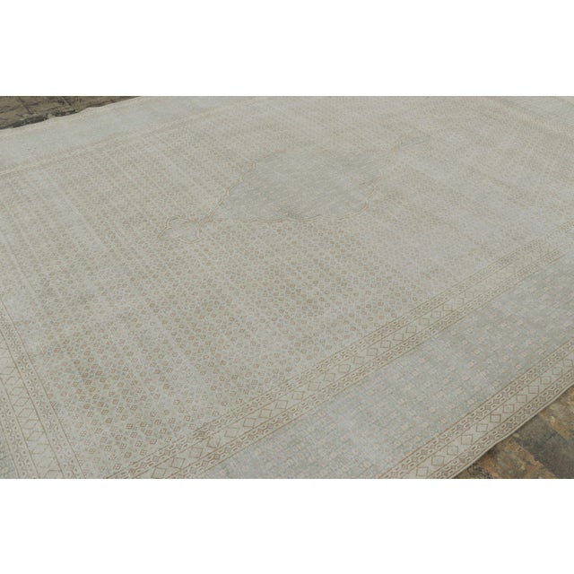 Hand-knotted in wool circa 1920-1929, this 9x13 vintage Persian Tabriz rug is a striking addition to Rug & Kilim’s Vintage...
