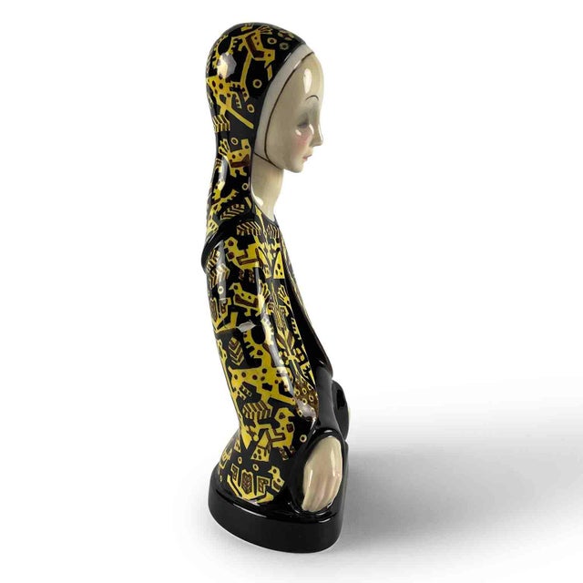 A female figure from the italian ceramics manufacturer lenci, known as "raccettazione" (resignation), created by helen...