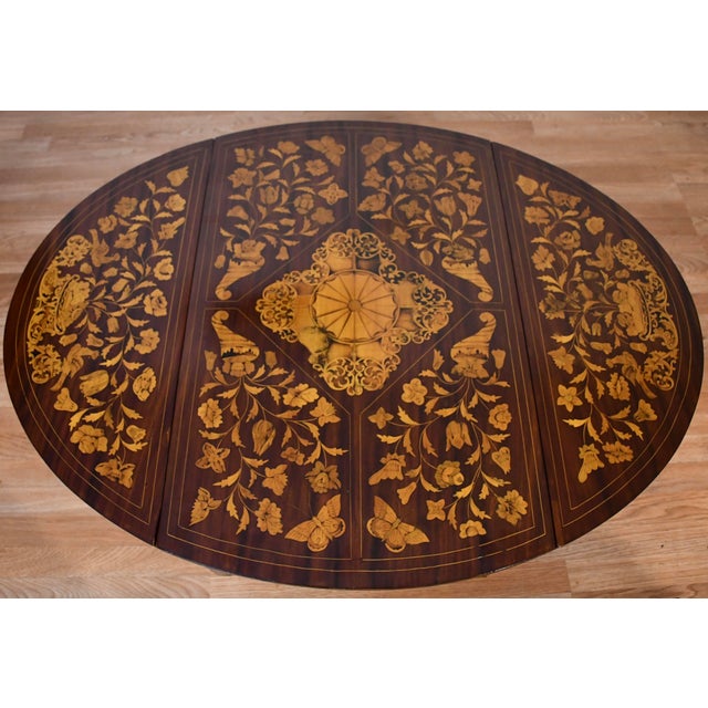 We are pleased to offer this Charming Dutch Marquetry coffee table, from the 1900s. This table is made of Mahogany wood...