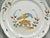 18th-Century hand painted French polychrome faience plate with bird from Nevers, France. It features a scalloped edge hand...