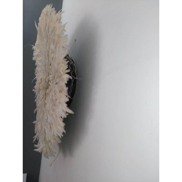 Juju hat white of 31" (80 cm). Juju hat made with natural feathers and rattan. Juju hat woven and handcrafted. Beautiful...
