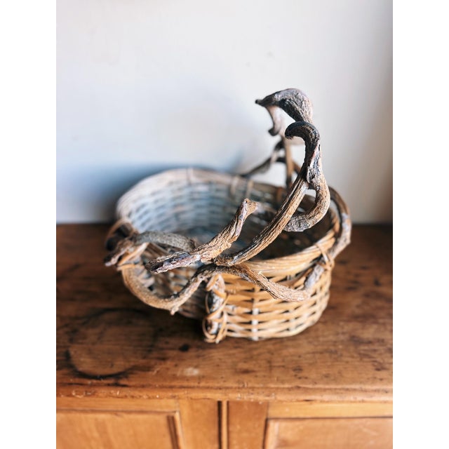 Rustic vintage vine twig handle woven oval basket.