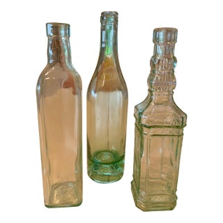 Vintage Set of Three Tall Light Green Bottles For Sale