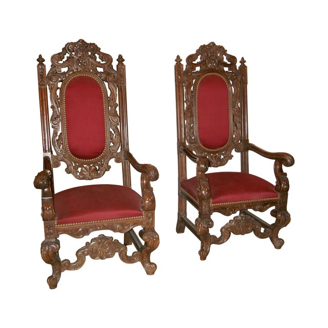 Victorian revival styling blends Renaissance and Baroque elements in this pair of Italian walnut wood chairs. Heavy...