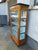 Very elegant, three-sided glazed, single-door display cabinet, 3 levels with rungs and shelves, ebonized cornice strip,...