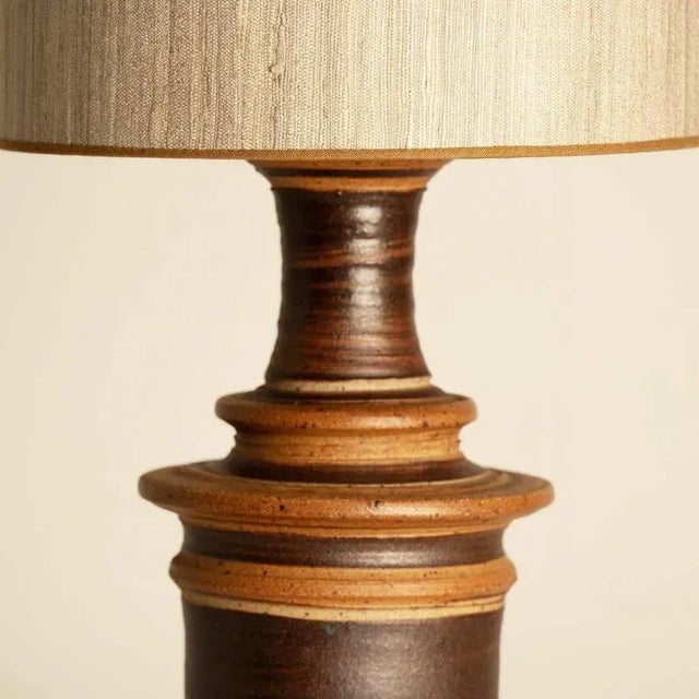 Heavy quality ceramic table lamp by Tue Poulsen for Tue Keramik, 1970s Denmark. This lamp base brings refined elegance and...