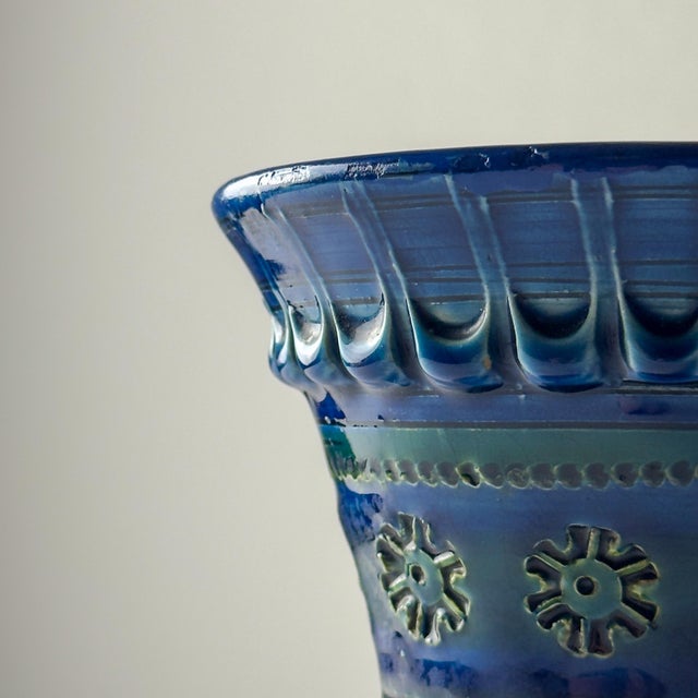 Mid-Century round Italian pottery vase with Bitossi Rimini Blue pattern. The outside surface of the vase is decorated with...