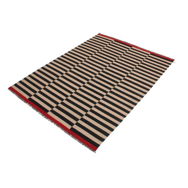 Add a touch of elegance to your home with this casual chic hand woven Tribal Kilim wool rug. Constructed on a loom by...