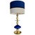 Table lamp with a central structure composed of blown glass and brass elements, with translucent white and blue details...