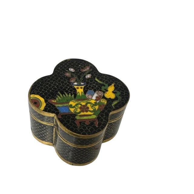 Small clover shape cloisonné trinket box — delicately crafted with colorful enamel and fine metal detailing. Features...