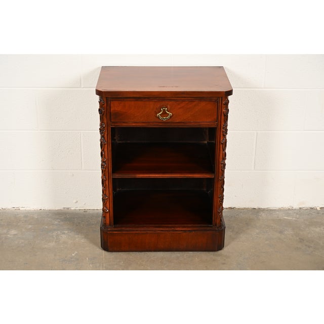 A beautiful Georgian or Chippendale style nightstand or bedside table By Century Furniture USA, 1950s Figured mahogany,...