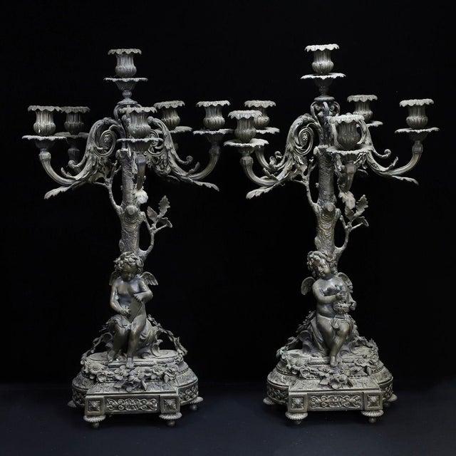 This is a magnificent, large-scale matching pair of vintage bronze candelabras, crafted in the ornate French Rococo style....