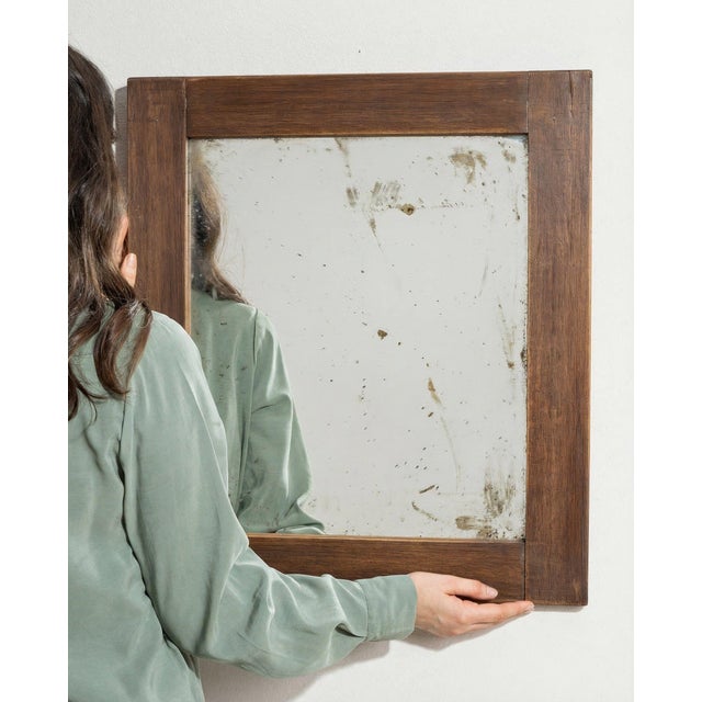 Here is a mirror, its natural oak frame, rectangular the first thing to catch the eye. Dating to 1970s and originating...