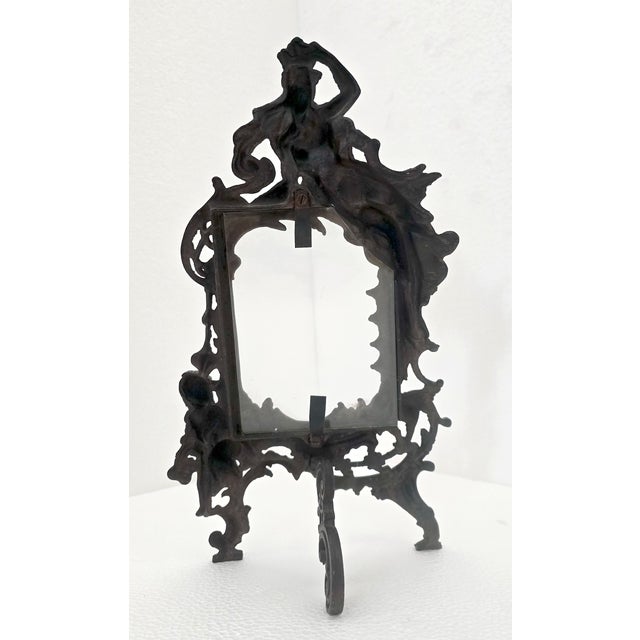 Antique late 19th century reticulated cast iron easel style picture vanity frame, featuring a swirling foliate art nouveau...