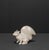 This white glazed stoneware squirrel is a decorative vintage object from the 1960s that impresses with its beautiful shape...