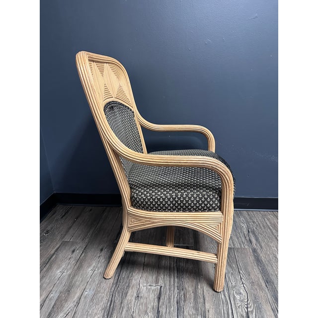 Add texture and natural charm to your space with this set of four vintage pencil reed armchairs. Each chair features...