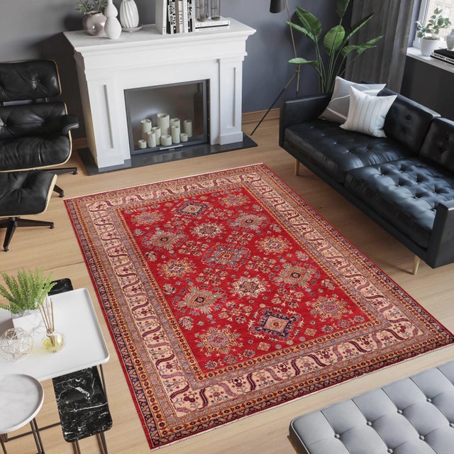 Enhance your home with this exquisite hand-knotted Super Kazak rug, crafted from fine hand-spun wool and dyed with all-...