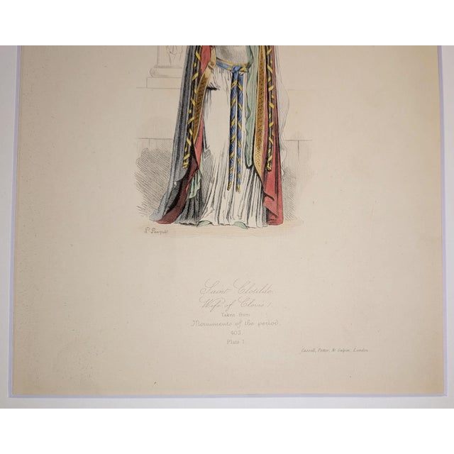 A finely detailed 19th-century hand-colored engraving featuring Saint Clotilde, Wife of Clovis I, portrayed in early...