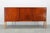 This refined Danish mid-century sideboard from the 1960s exemplifies Scandinavian craftsmanship and functional elegance....
