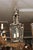 A striking pair of bronze-finished lantern pendants with flowing frames and softly bowed glass panels. The art Nouveau...