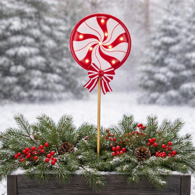 Add a sweet touch of holiday magic to your yard with this LED Peppermint Lollipop Planter Stake. Designed with a classic...