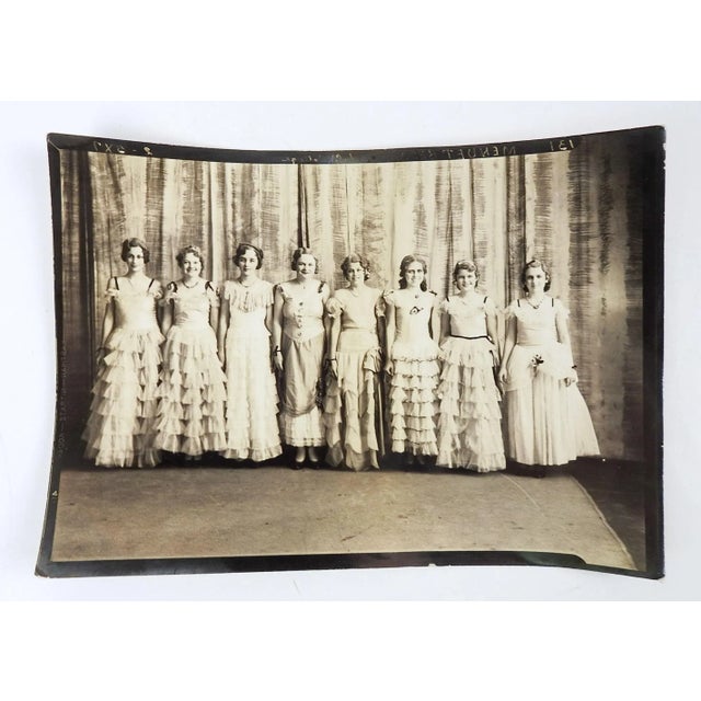 Vintage 1930's photograph of a group of young women all dressed in ruffled gowns. Unframed, 7" x 5", edge wear.