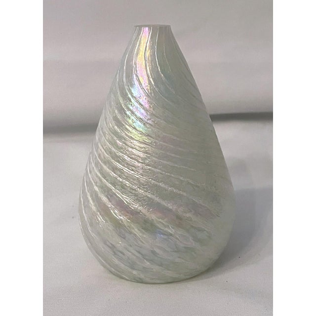 Beautiful iridescent white glass bud vase by Glass Eye USA. Teardrop shaped with swirl pattern