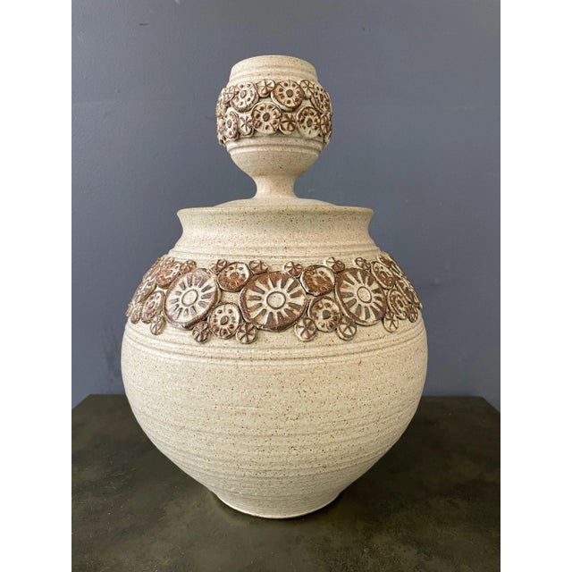 Vessel is instantly recognizable as the work of Wishon-Harrell. The circular appliqué pieces are instantly a giveaway. The...