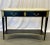 Pair of Hollywood Regency Neoclassical Ebony Console Tables, Manner Jansen Pair of Hollywood Regency neoclassical ebony...