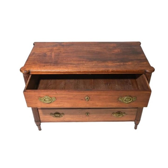 Antique Louis XVI style three drawer commode chest of drawers. Carved fluted legs on all four corners and unique original...