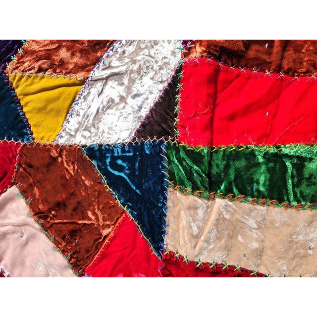 19thc velvet crazy quilt with embroidery and ties. This quilt is in pristine condition. The backing is a blue calico...