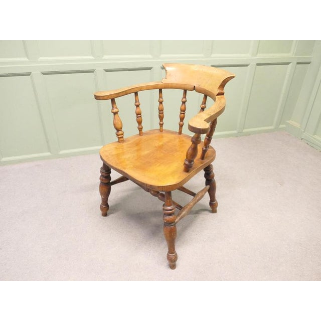19th Century Beech and Elm Smokers Bow Office or Desk Chair This solid chair has an attractive thick saddle shaped seat in...