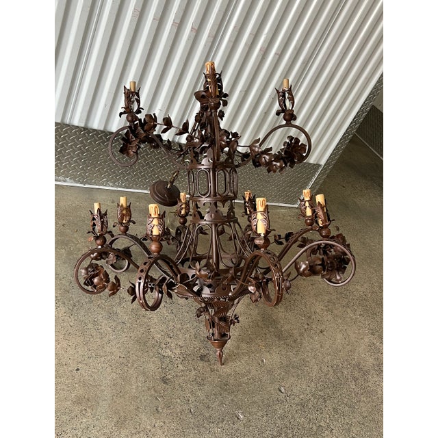Large Wrought Iron Chandelier With Leaves sold as found previously owned without damage in working condition.