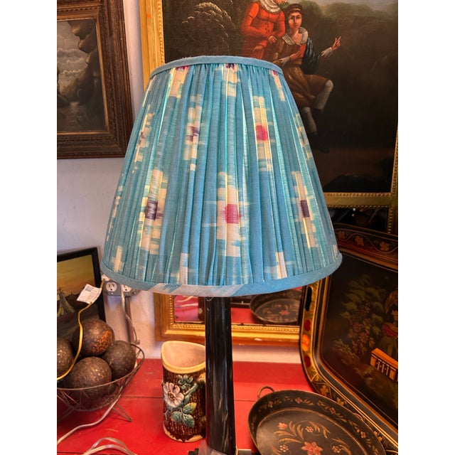 A handmade shade from a lovely vintage hand loomed Ikat cotton, measures top 8.5 bottom 16” side 13”