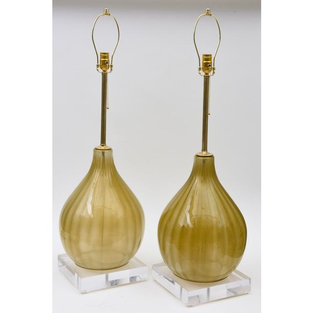 These amazing and gorgeous Italian Mid Century Modern bulbous Murano glass table lamps are fully restored from top to...