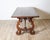 An exceptional 18th-century Italian Fratino table, handcrafted in solid walnut with beautifully aged patina and...