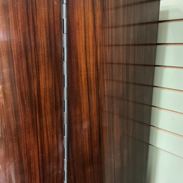 The Metropolis armoire by Ralph Lauren is a statement of Art Deco style with functional storage. Made with a Madagascar...