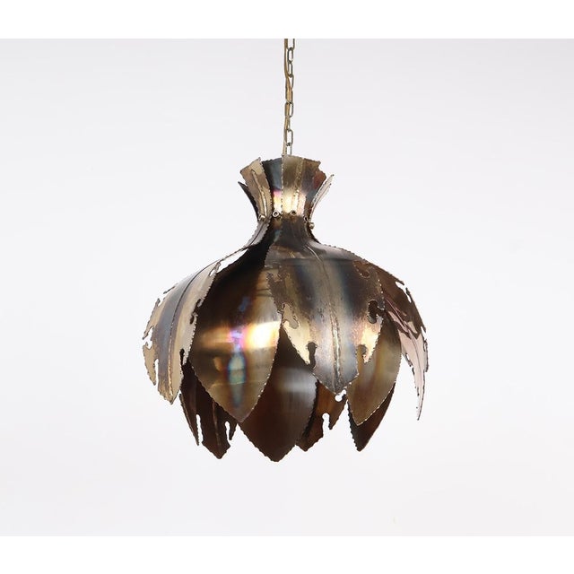 Beautiful Brutalist pendant lamp from the 1960s, made of brass and shaped like an onion. Designed by Svend Aage Holm...
