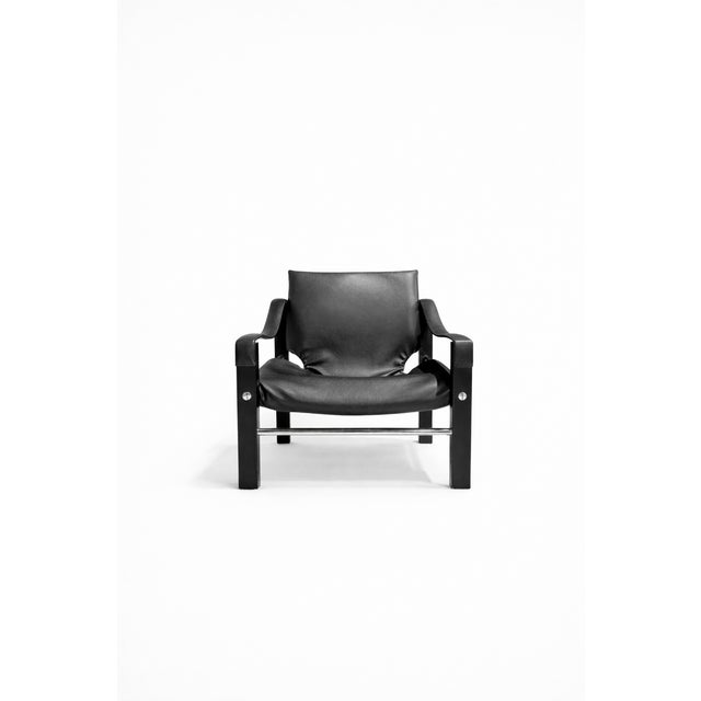 Safari chair, designed by Maurice Burke for the British company Arkana in the 1960s. with a wooden frame featuring some...